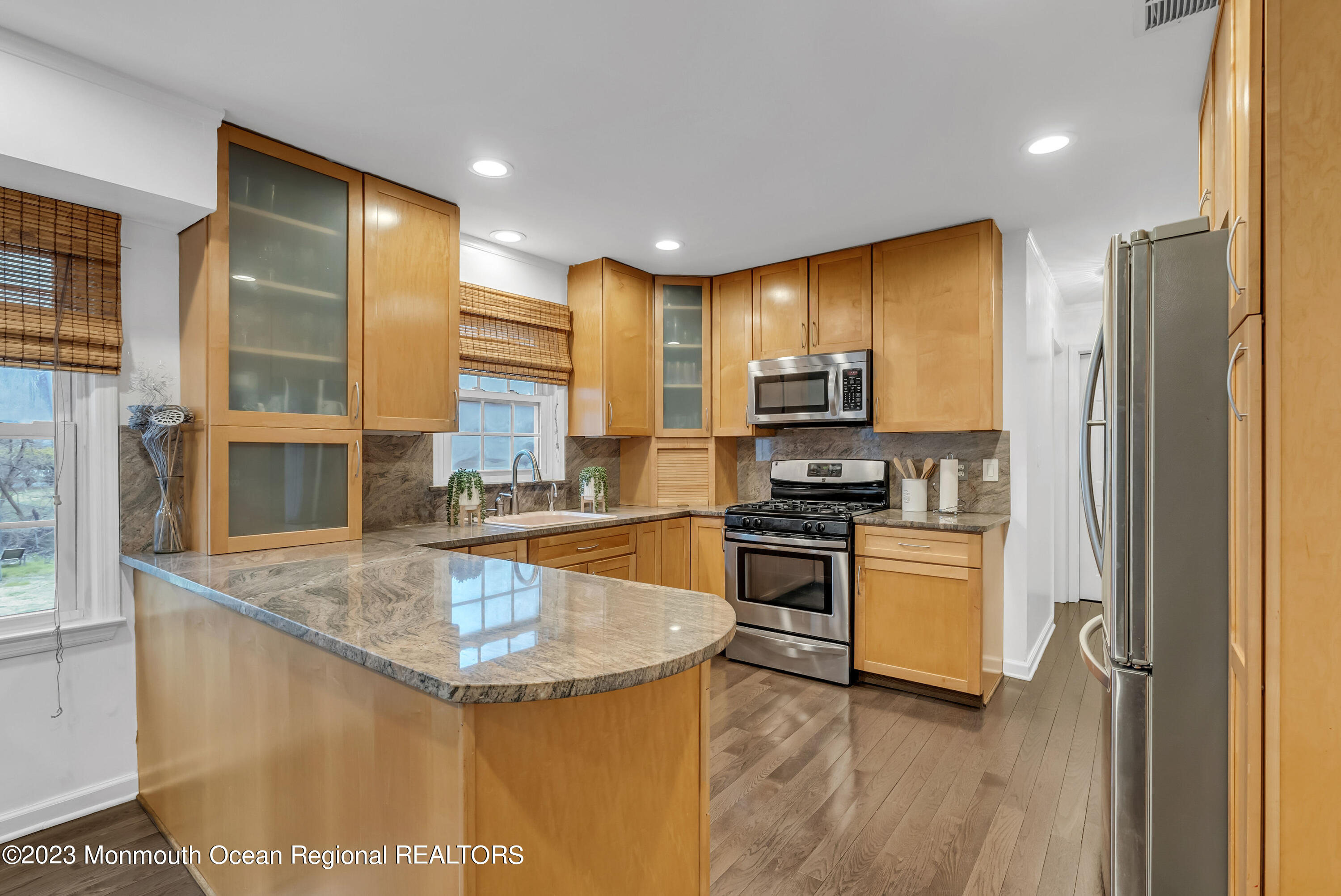2912 Logan Road Asbury Park, NJ 07712 - Photo 4 of 30 a kitchen with stainless steel appliances granite countertop a sink stove and refrigerator