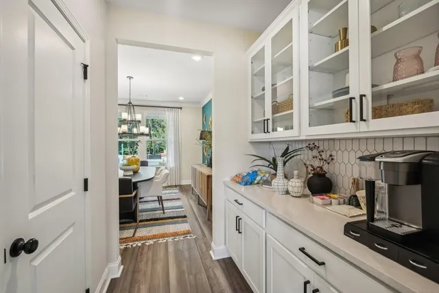 a kitchen with a refrigerator and a sink
