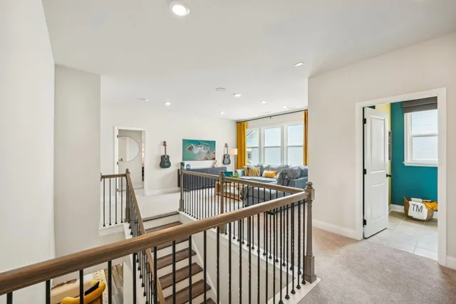 a view of a hallway with a living room