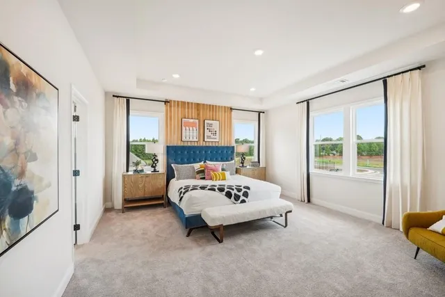 a bedroom with a bed and a couch