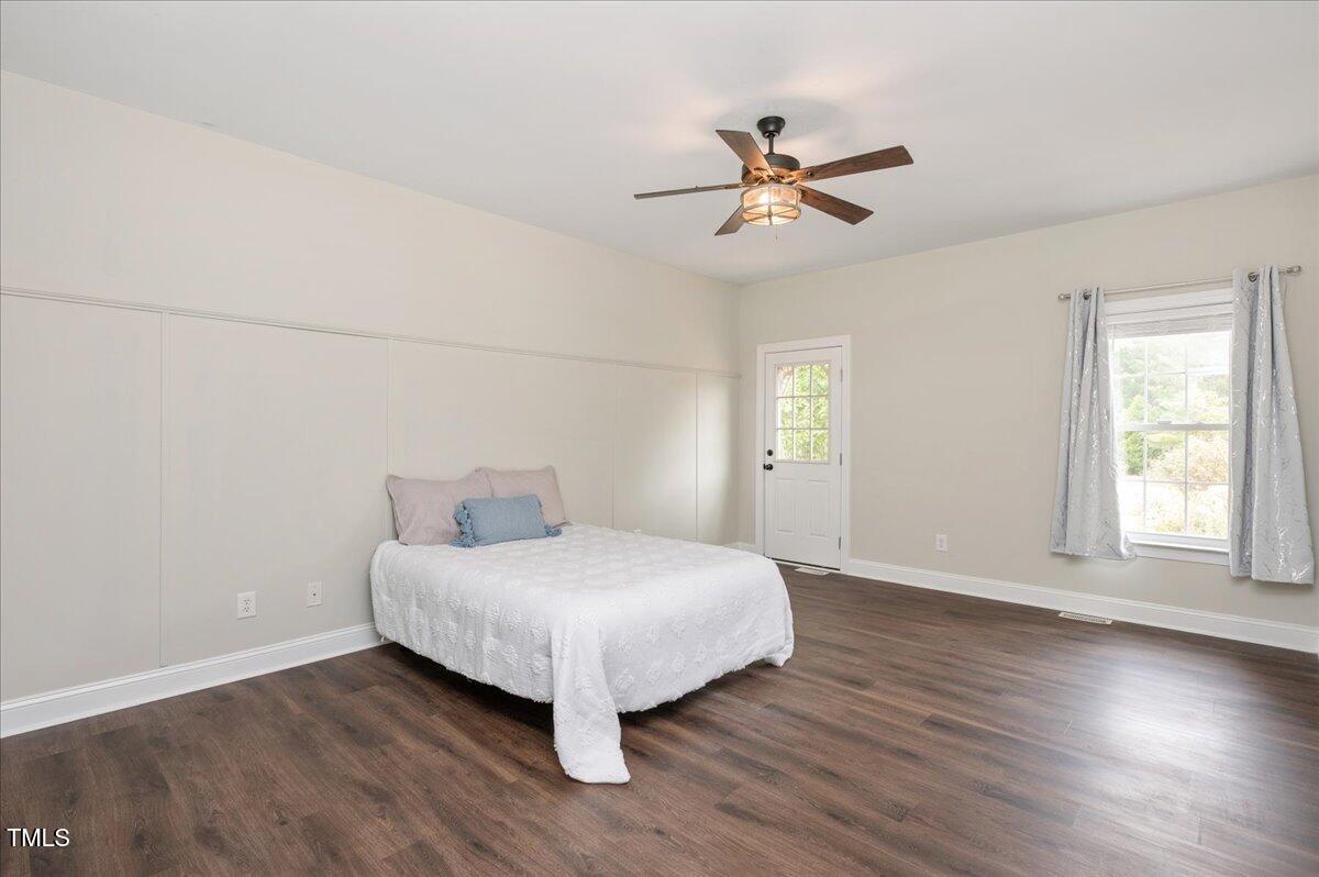 7805 Tuscan Ridge Drive Wendell, NC 27591 - Photo 15 of 40 a bedroom with a bed and a window