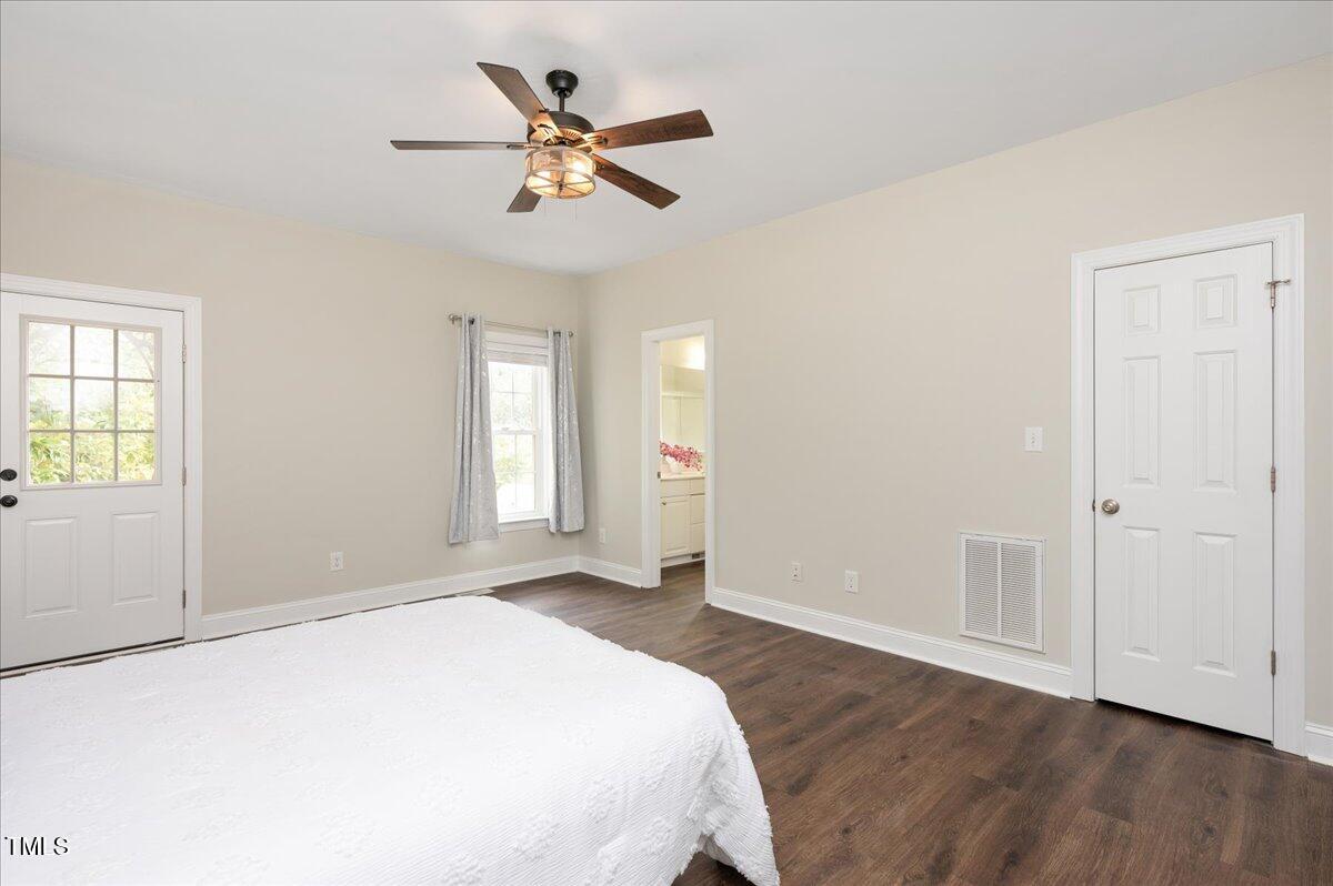 7805 Tuscan Ridge Drive Wendell, NC 27591 - Photo 16 of 40 a spacious bedroom with a bed and a window