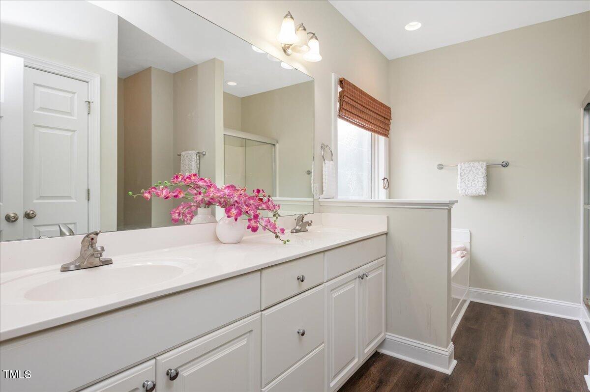 7805 Tuscan Ridge Drive Wendell, NC 27591 - Photo 17 of 40 a bathroom with a sink and a mirror