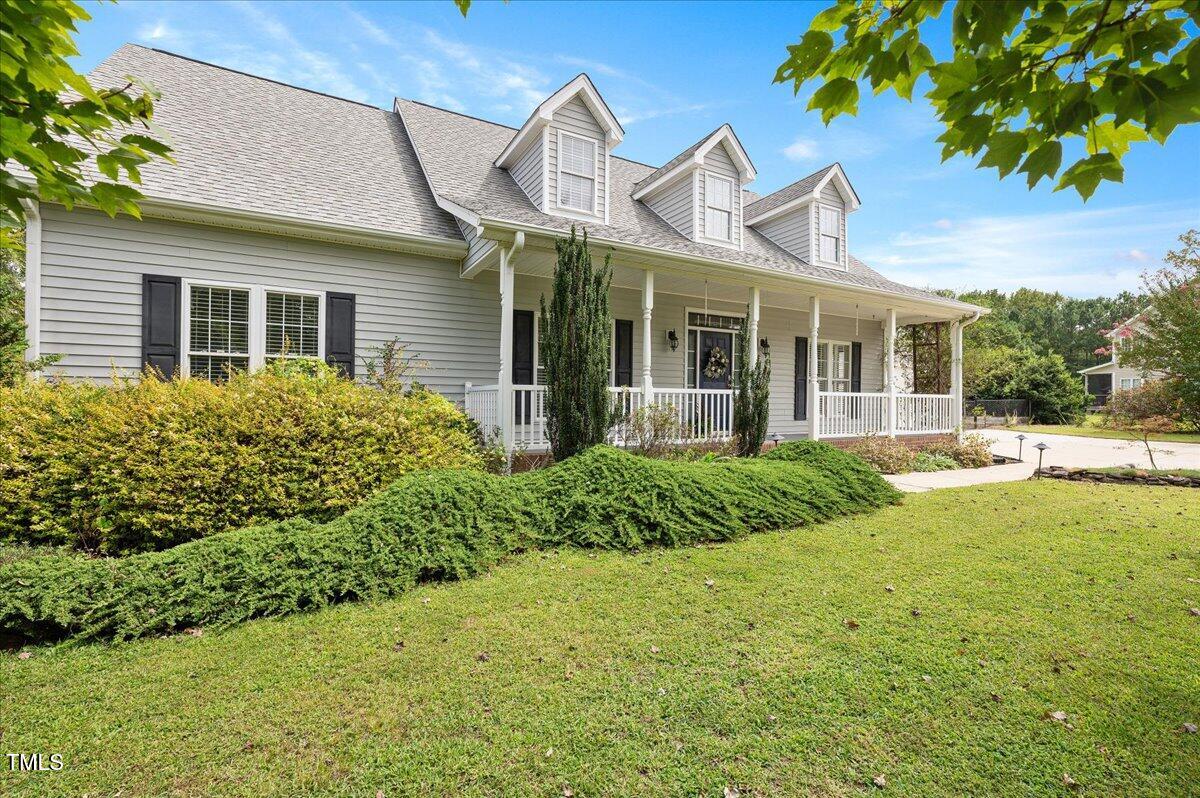 7805 Tuscan Ridge Drive Wendell, NC 27591 - Photo 3 of 40 a view of a house with a backyard and a garden