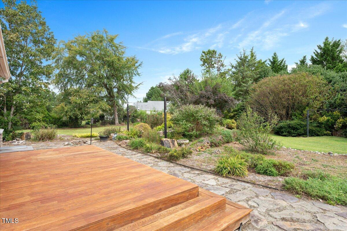 7805 Tuscan Ridge Drive Wendell, NC 27591 - Photo 32 of 40 a backyard of a house with lots of green space