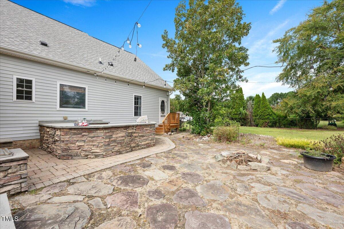 7805 Tuscan Ridge Drive Wendell, NC 27591 - Photo 35 of 40 a view of a house with backyard