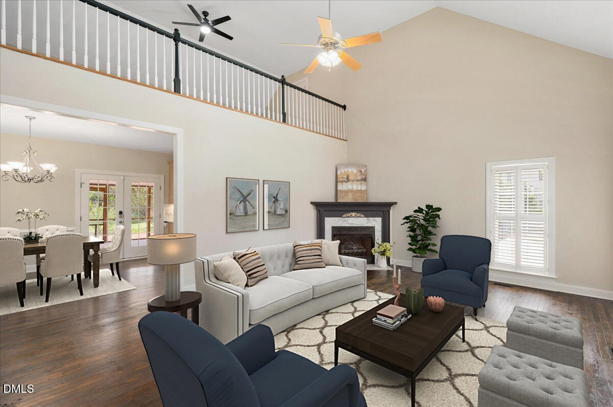 7805 Tuscan Ridge Drive Wendell, NC 27591 - Photo 4 of 40 a living room with furniture fireplace and a window