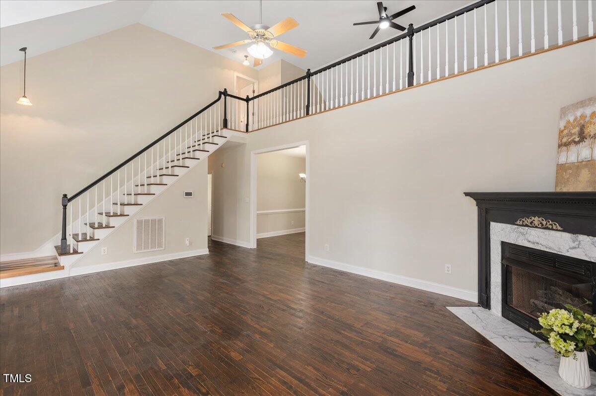 7805 Tuscan Ridge Drive Wendell, NC 27591 - Photo 6 of 40 a view of entryway and hall with wooden floor