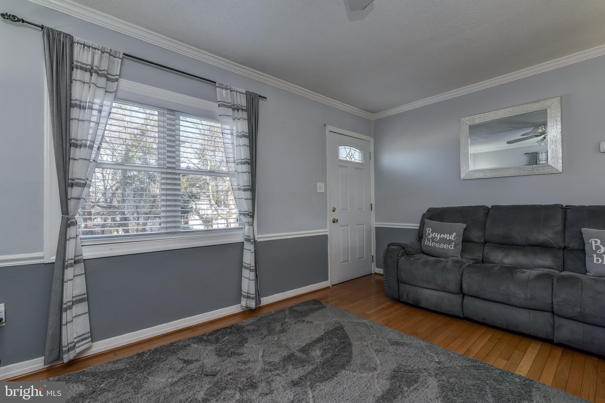 4506 Clearfield Road Silver Spring, MD 20906 - Photo 5 of 38 Living Room With HW Floor and New Windows