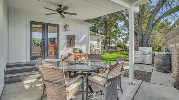 a view of a house with a backyard