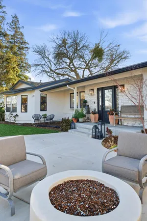 a view of swimming pool with outdoor seating