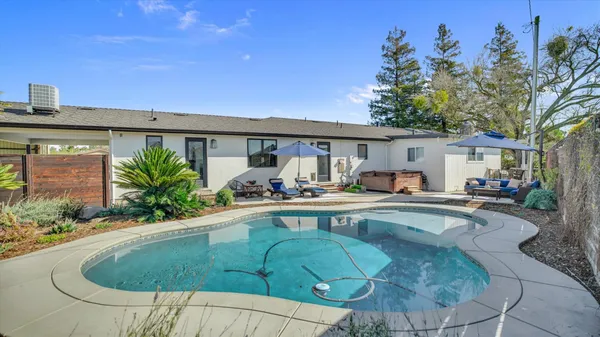 a outdoor space with patio the couches and a umbrella