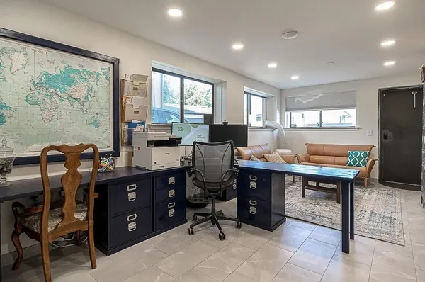 a living room with furniture a rug and a window