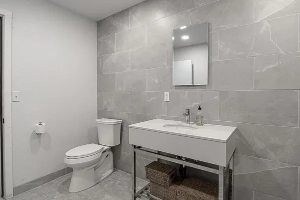 a view of a chairs and table in the balcony