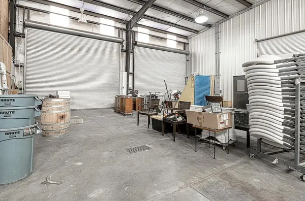 a view of a patio with table and chairs potted plants