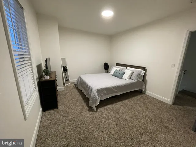 a bed room with a bed and a couch