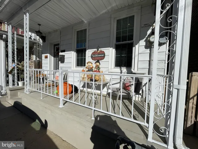 a view of a chairs and table in a balcony