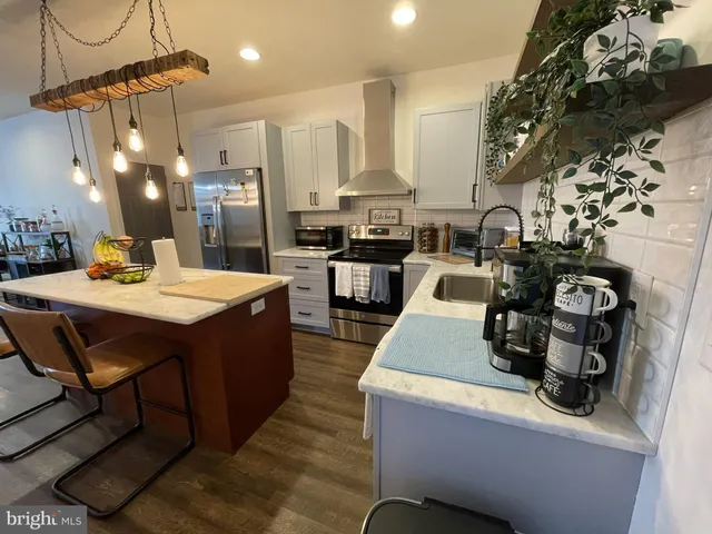 a kitchen with a sink and stove
