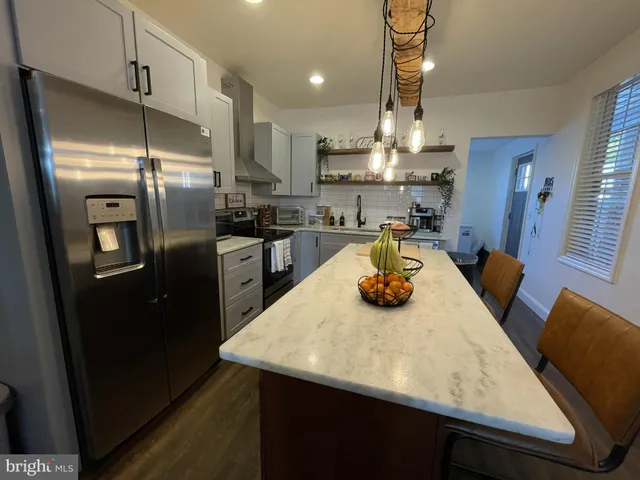 a kitchen with refrigerator and countertop