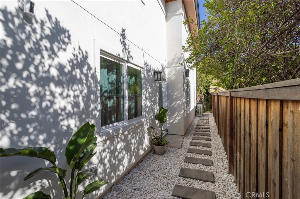 19429 Singing Hills Drive Porter Ranch, CA 91326 - Photo 19 of 26 a view of a house with backyard and trees