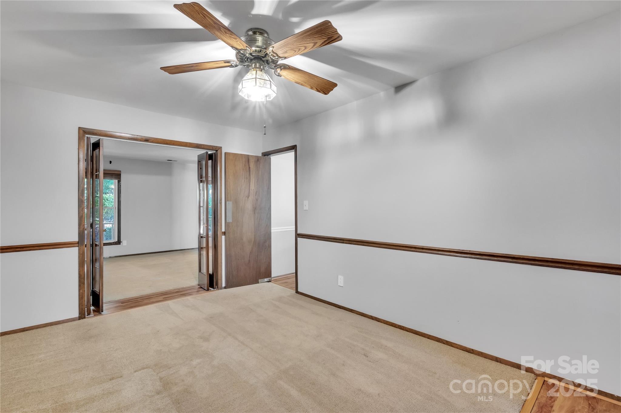 702 Trail Ridge Road Matthews, NC 28105 - Photo 14 of 36 a view of an empty room and chandelier fan