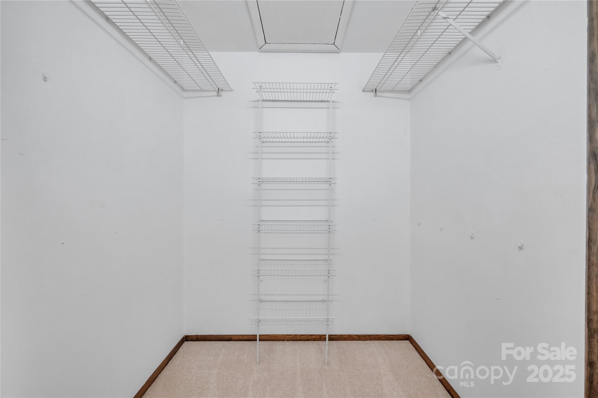 702 Trail Ridge Road Matthews, NC 28105 - Photo 19 of 36 a view of walk in closet with empty racks