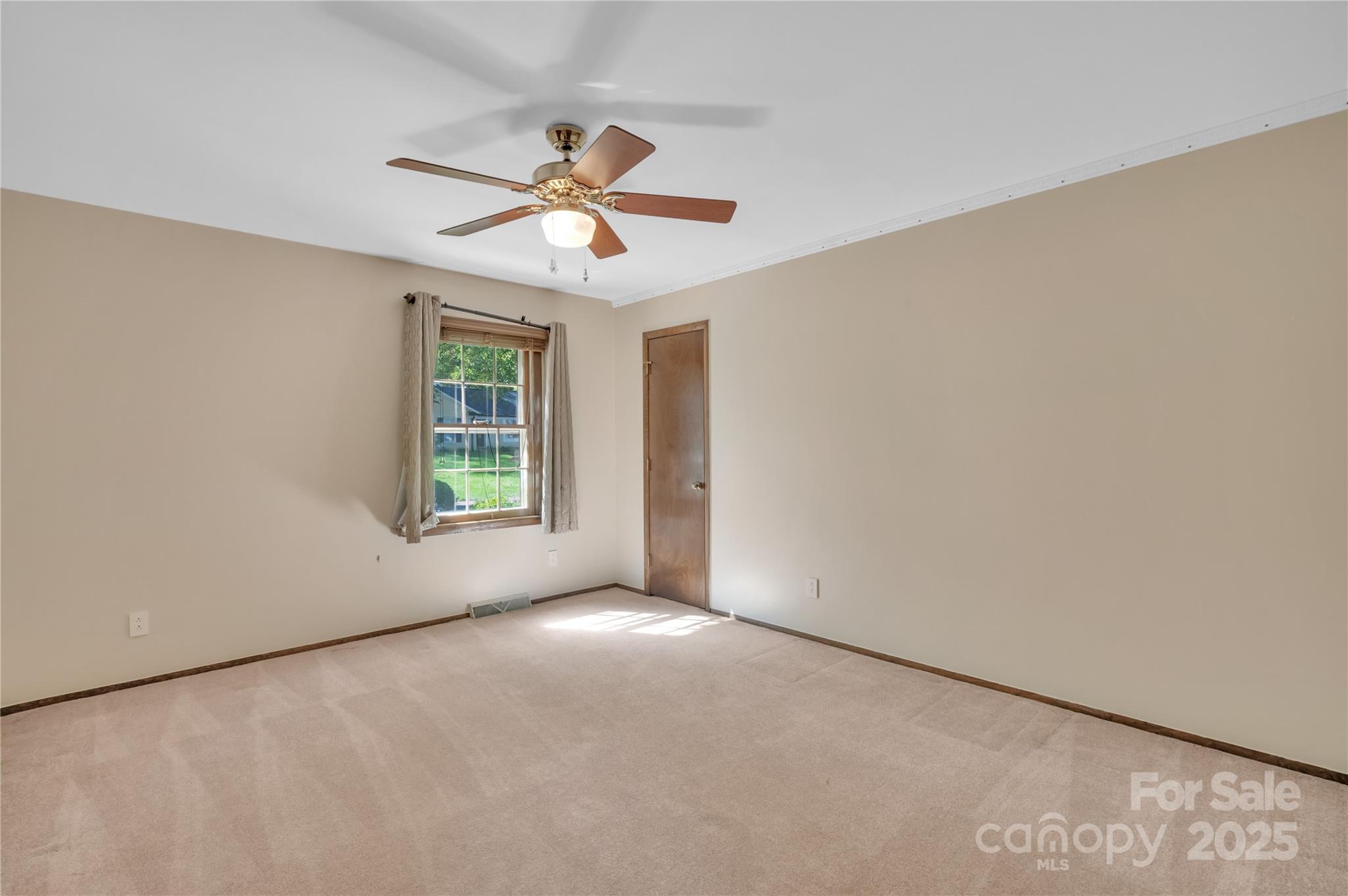 702 Trail Ridge Road Matthews, NC 28105 - Photo 20 of 36 an empty room with windows and fan