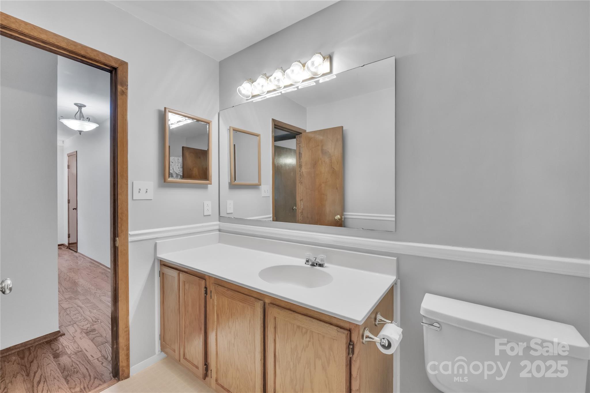 702 Trail Ridge Road Matthews, NC 28105 - Photo 23 of 36 a bathroom with a sink and a mirror