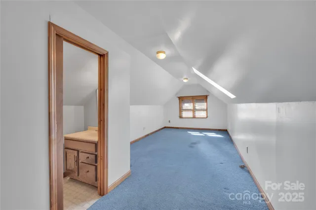 a view of livingroom with hardwood floor and hallway