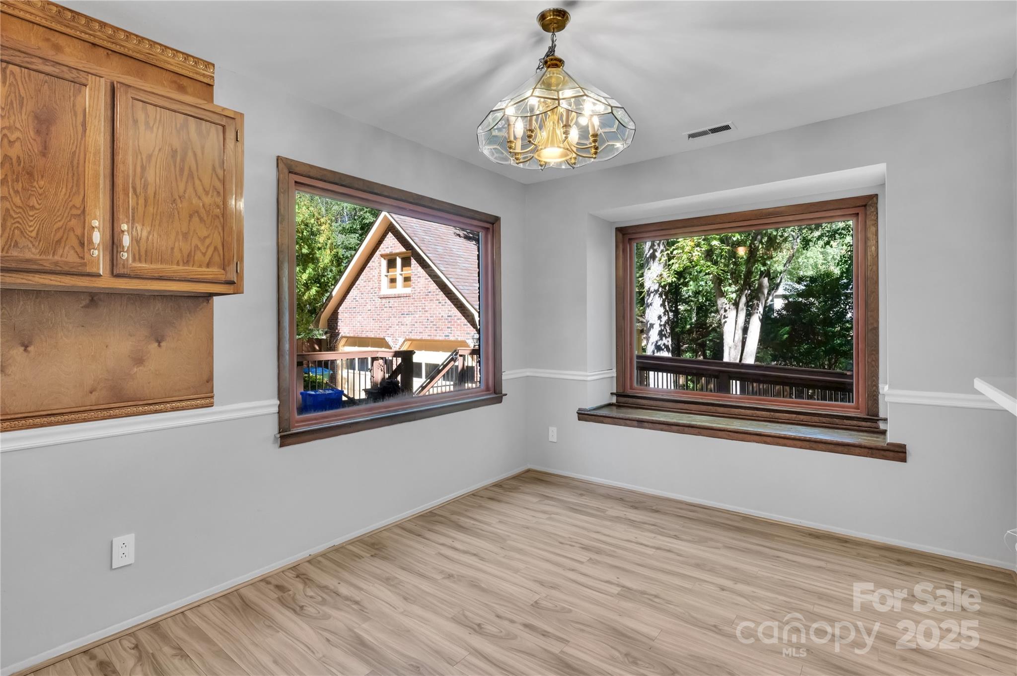 702 Trail Ridge Road Matthews, NC 28105 - Photo 7 of 36 a view of empty room with wooden floor and fan