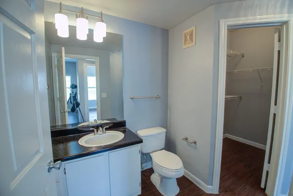 a bathroom with a sink vanity and a mirror