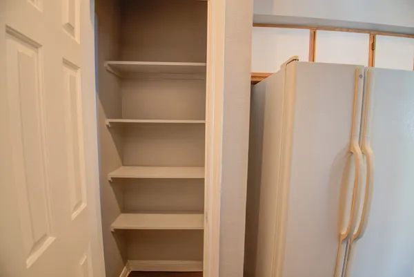 a white refrigerator freezer and a microwave