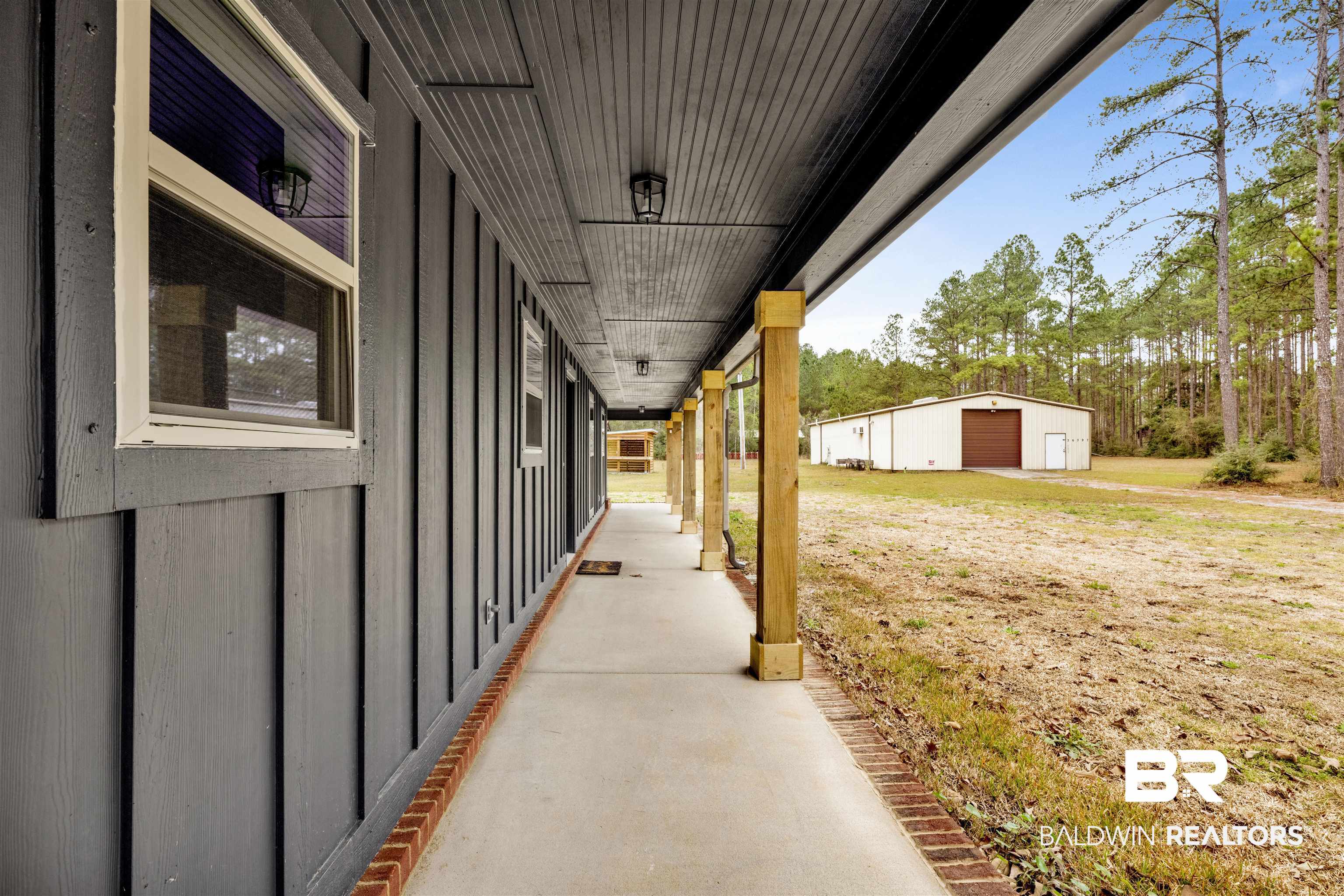 36397 Alexandria Trail Stapleton, AL 36578 - Photo 19 of 65 Porch featuring an outbuilding and a detached garage