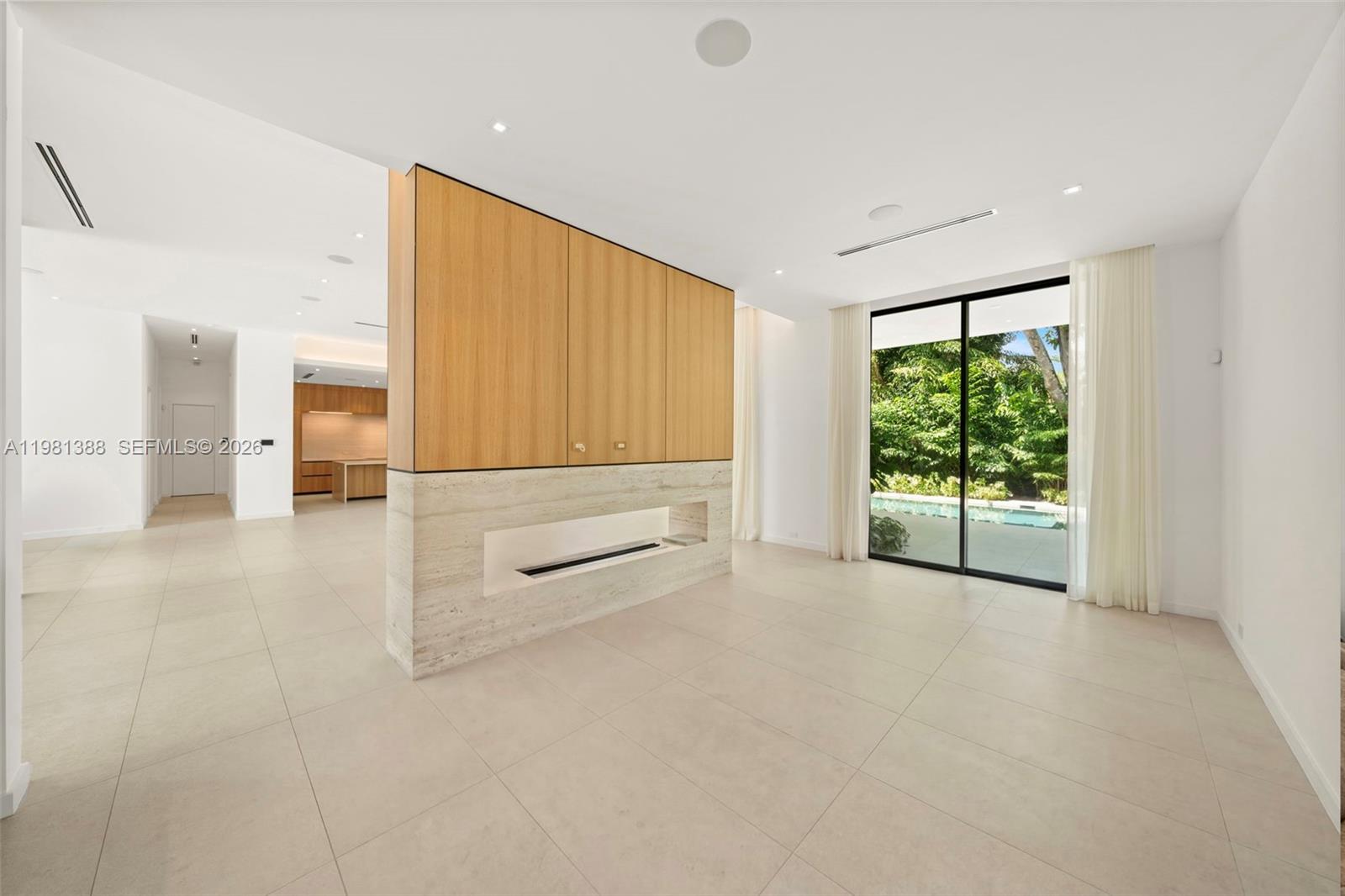 7700 Southwest 50th Court Miami, FL 33143 - Photo 13 of 62 a view of an empty room with a sliding door