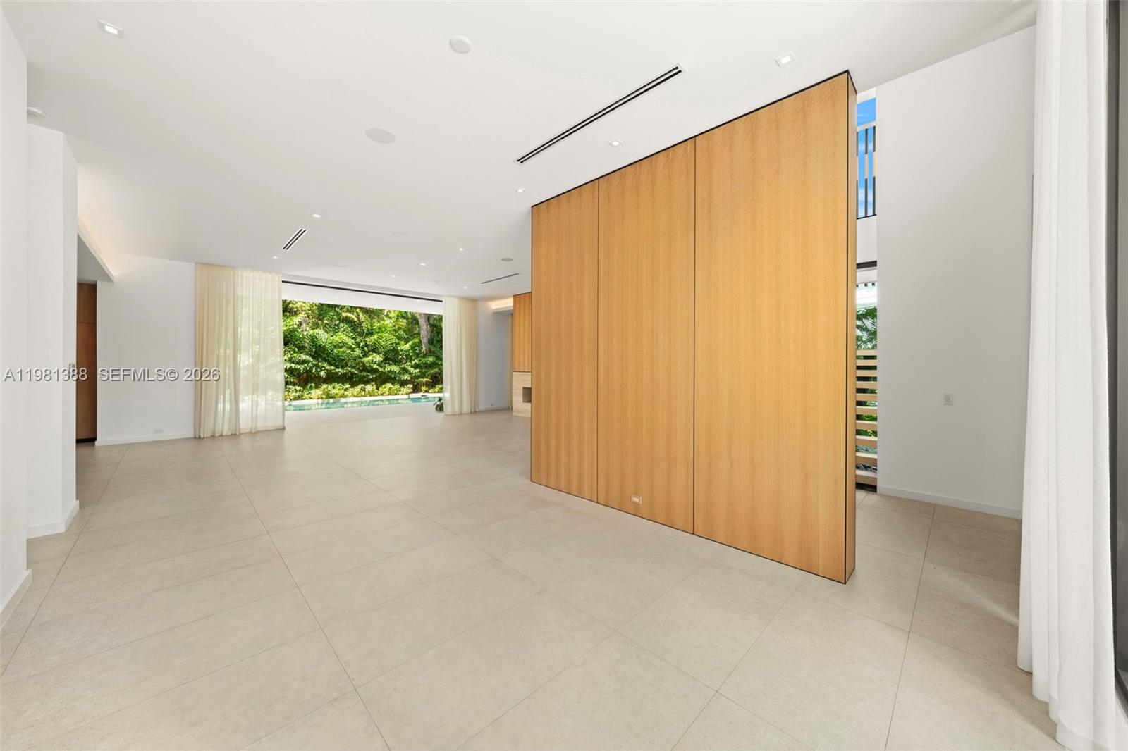 7700 Southwest 50th Court Miami, FL 33143 - Photo 14 of 62 a view of an empty room with a window
