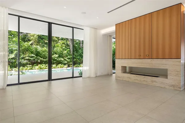 a kitchen with a sink and large window