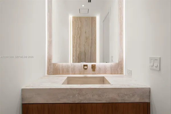 a kitchen with a stove a sink and a refrigerator