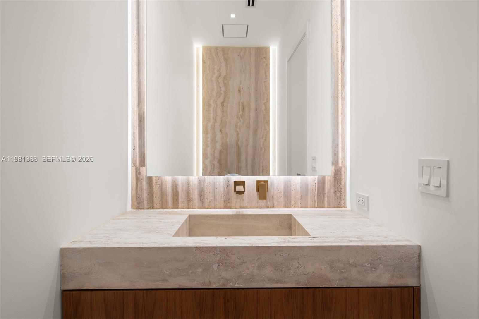 7700 Southwest 50th Court Miami, FL 33143 - Photo 16 of 62 a bathroom with a granite countertop sink and a mirror