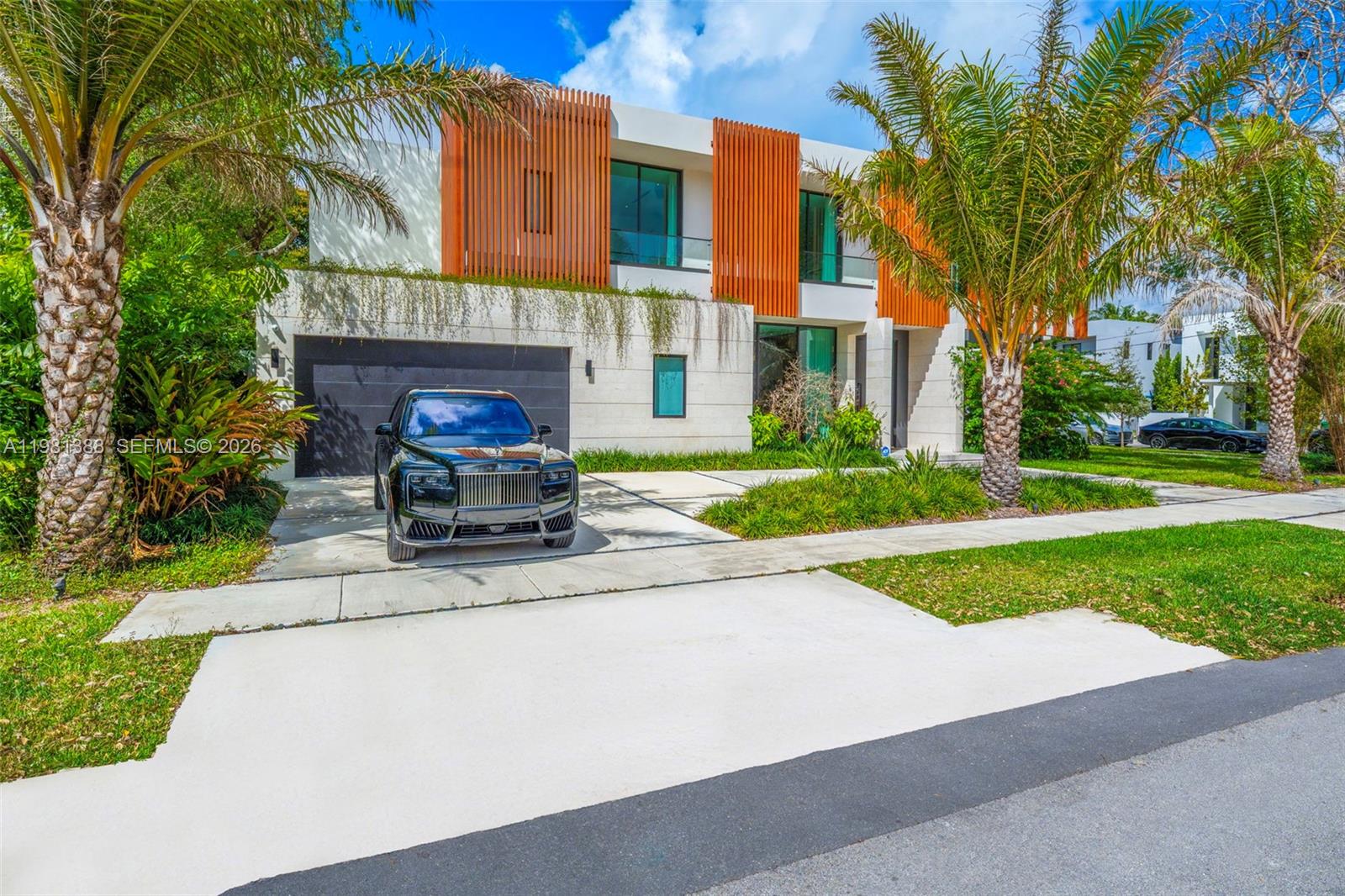 7700 Southwest 50th Court Miami, FL 33143 - Photo 2 of 62 a view of a house with a yard and a street