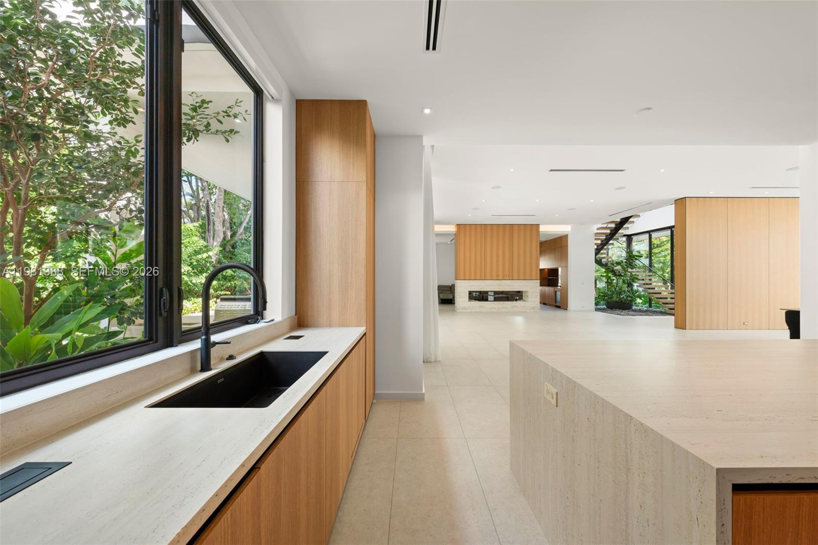 7700 Southwest 50th Court Miami, FL 33143 - Photo 25 of 62 a large white kitchen with a large window