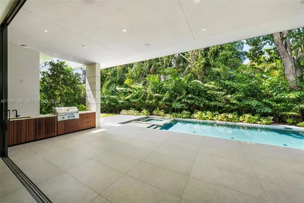 a view of an empty room with a sliding door