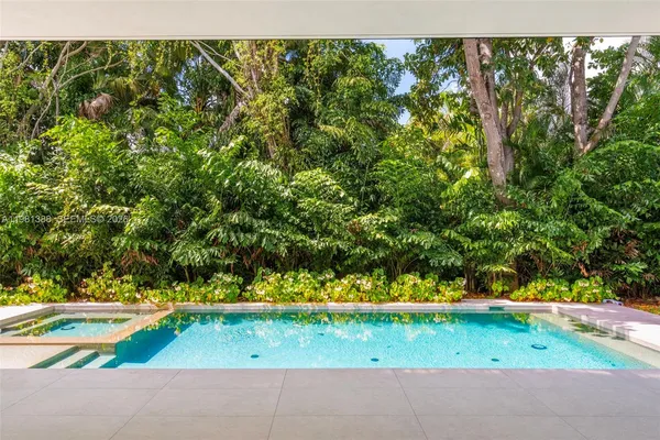 a view of a livingroom with an empty space and a window