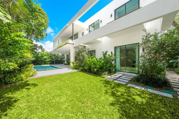 a bathroom with a bathtub and a chandelier