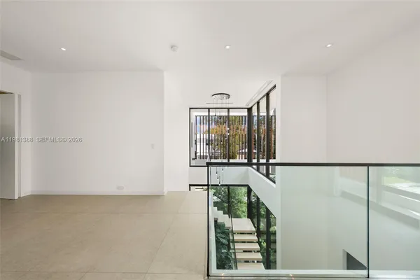 a view of a room with a potted plant and a window