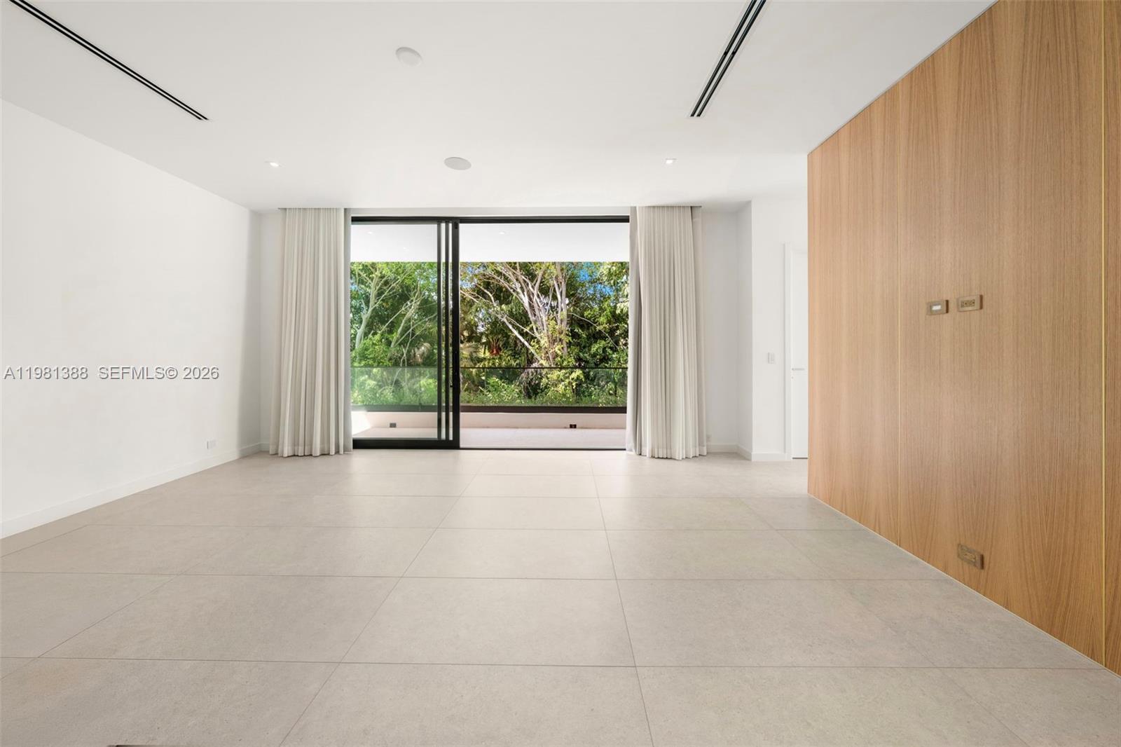 7700 Southwest 50th Court Miami, FL 33143 - Photo 38 of 62 a view of an empty room with a window