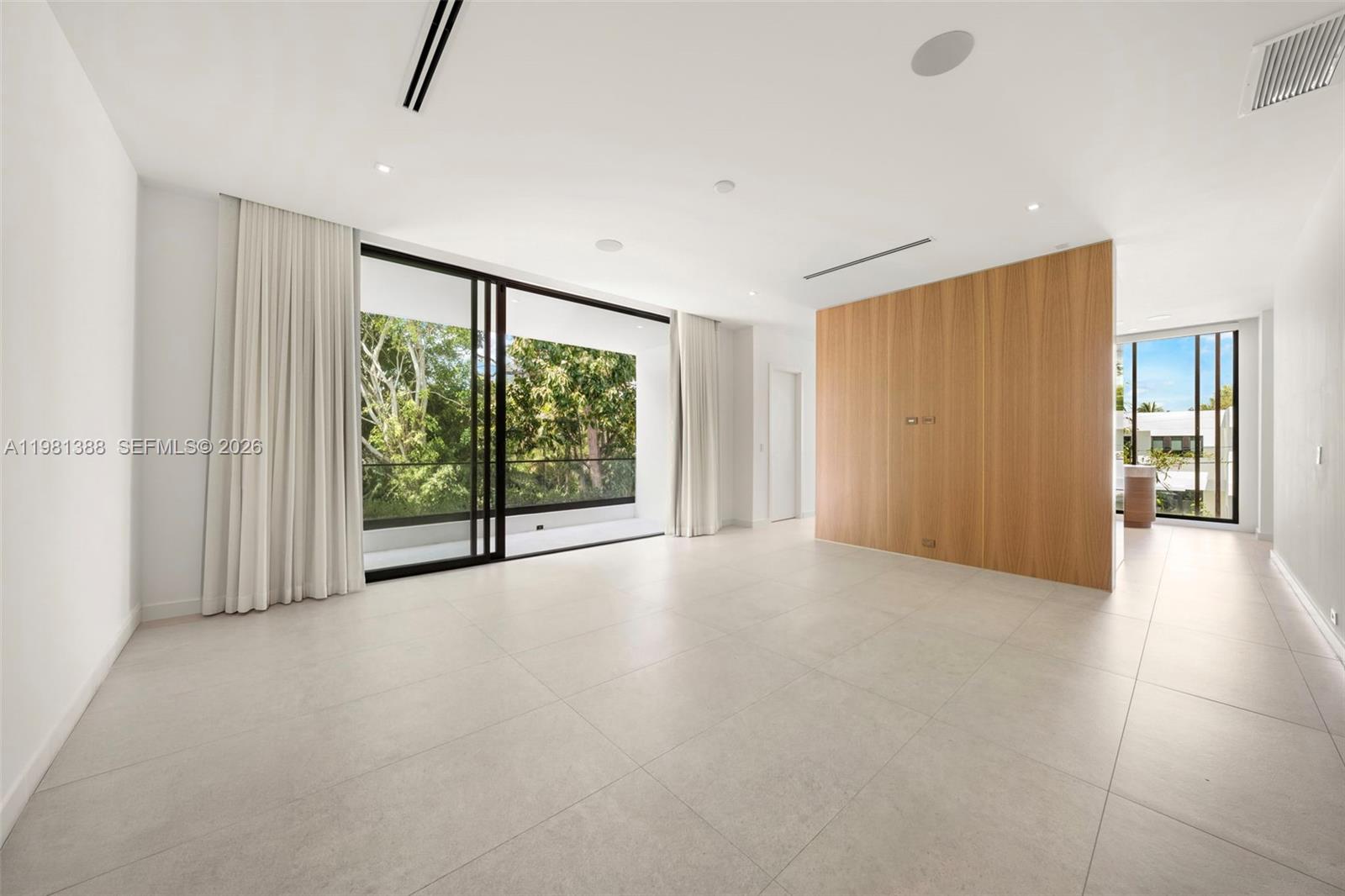 7700 Southwest 50th Court Miami, FL 33143 - Photo 40 of 62 a view of a livingroom with an empty space and a window