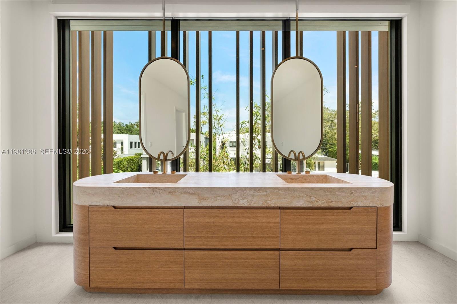 7700 Southwest 50th Court Miami, FL 33143 - Photo 45 of 62 a bathroom with a granite countertop sink and a mirror