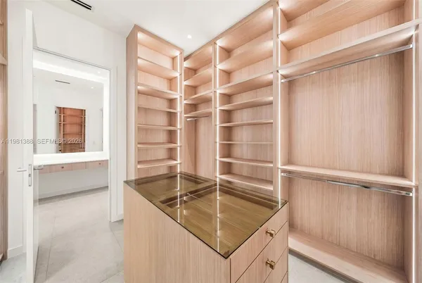 a bathroom with a double vanity sink toilet and shower