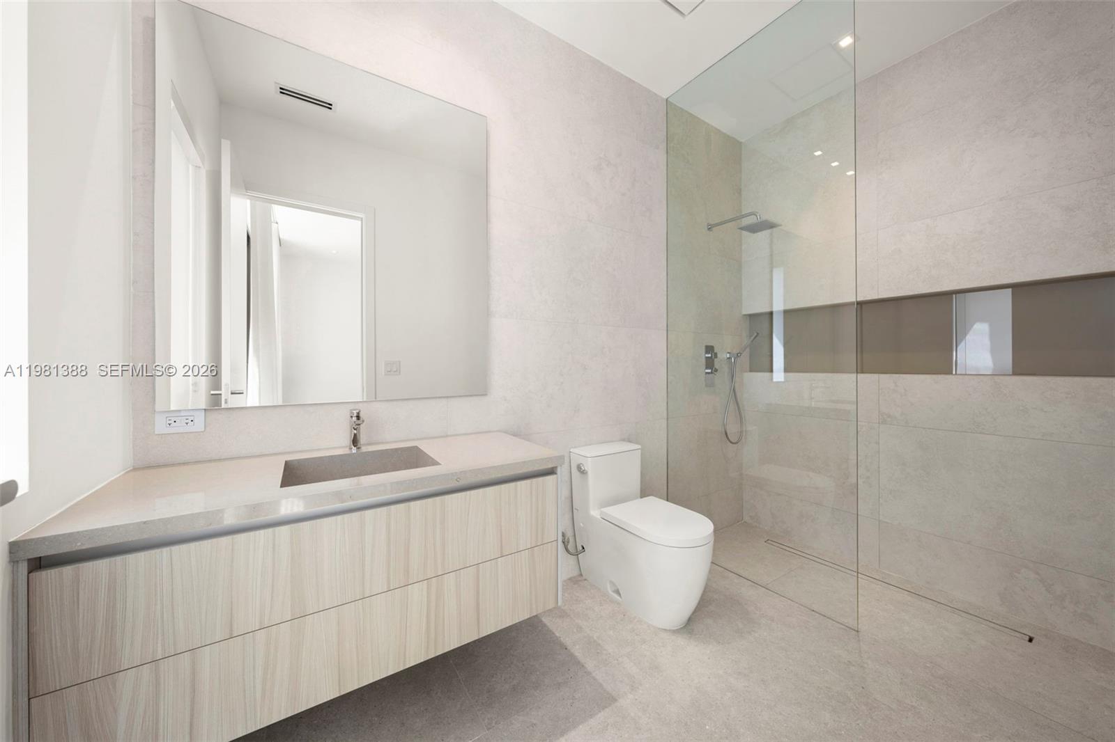 7700 Southwest 50th Court Miami, FL 33143 - Photo 60 of 62 a bathroom with a double vanity sink toilet and shower