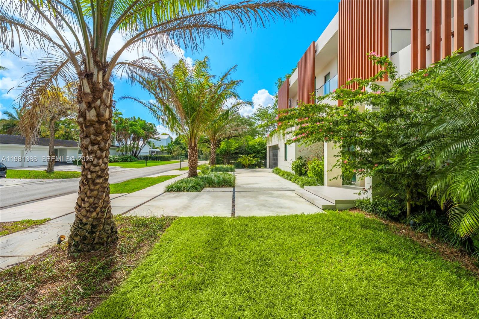 7700 Southwest 50th Court Miami, FL 33143 - Photo 6 of 62 a view of a house with a yard and tree s